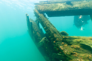 Naklejka na ściany i meble Damaged stern of the sunken wooden schooner Bermuda from the deck