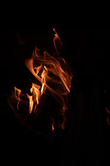 bonfire flames at night, dark background