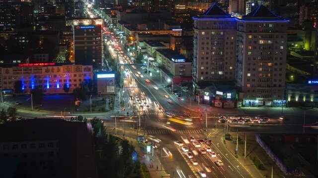 Timelapse view of night traffic on major intersection in central Ulan Bator, the capital and largest city of Mongolia. 