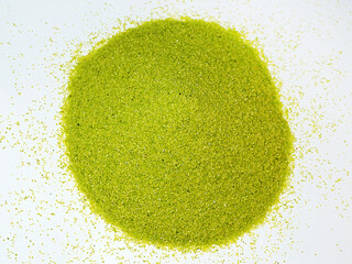 green kinetic sand for sand therapy on white background