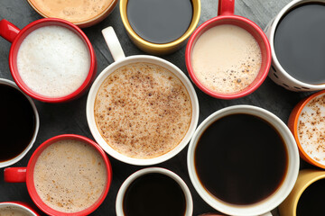 Many cups of different coffees on table, flat lay
