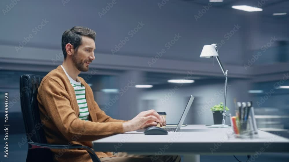 Poster 360 degree modern office: handsome businessman sitting at his desk working on a laptop computer. man