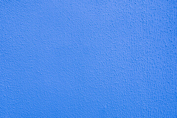 Blue wall of embossed decorative plaster