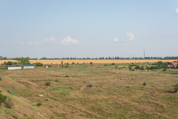 Fototapeta na wymiar countryside landscape fields in summer with yellow dry grass august ukraine