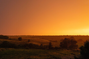 Fototapeta na wymiar rustic orange sunset ukrainian sunset landscape gradient cloudy sky