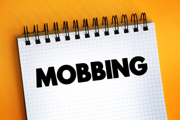 Mobbing text on notepad, concept background.