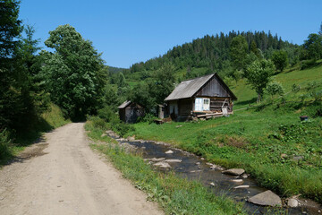 Fototapeta na wymiar Old wooden house in Carpathian Mountains, Ukraine