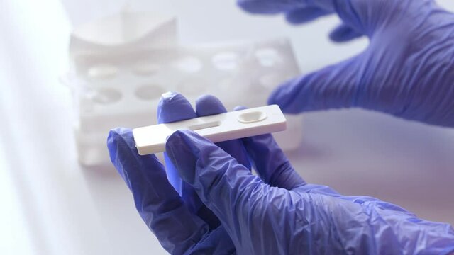 covid-19 antigen pcr express test, placing saliva