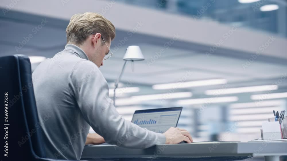 Aufkleber 360 degree modern office: businessman sitting at his desk working on a laptop computer. digital entr