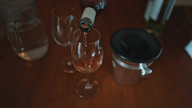 Sommelier pours a glass of wine for a tasting.