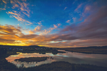 Fototapeta premium cloudscape of dusk over the lake