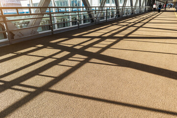 shadows in the elevated passage corridor bridge sun beams geometric lines