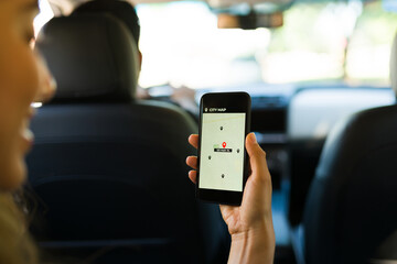 Young woman giving directions to the driver