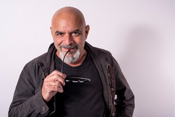 White background portrait of 60 years old mature man
