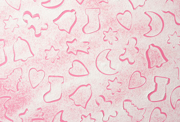 A pattern made on a sugar base with cake molds. Minimal new year concept design with pink background.