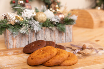 Home made giant cookies on wooden table with pieces of star anise and cinnamon