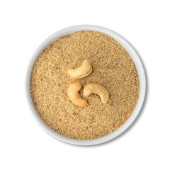Cashew nut flour in a bowl isolated over white background. Gluten free flour