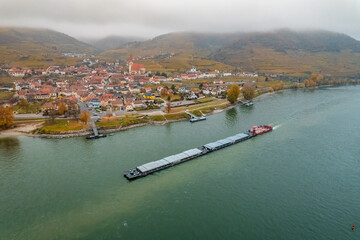 Pusher Boat Transporting Cargo on a Foggy Day on the River Danube