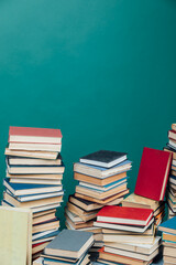 stacks of books in the university library on a green background