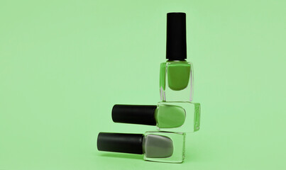 Obraz premium Nail polish in trendy green color.