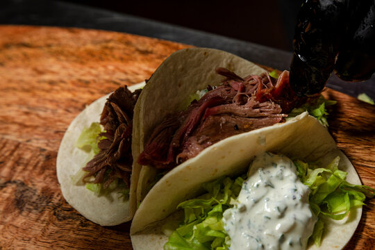 Chef Making Tacos With Smoked Beef And Vegetables