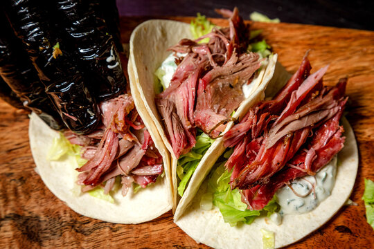 Chef Making Tacos With Smoked Beef And Vegetables