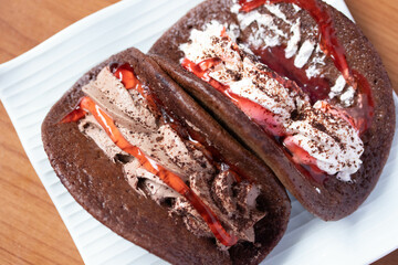 Creamy Chocolate Pancakes with Strawberry Sauce Close-up