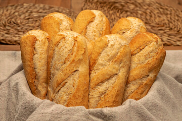 ARTISAN WHOLEMEAL BREAD ROLLS FRESHLY MADE IN THE BAKERY FOR RUSTIC HOAGIE.