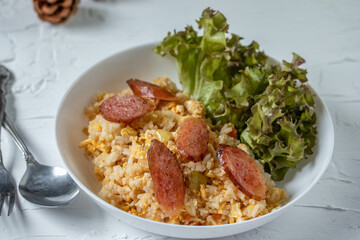 Fried rice with chinese sausage(Kun Chiang fried rice) in a white plate