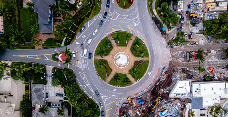 aerial drone of street circle with traffic in city