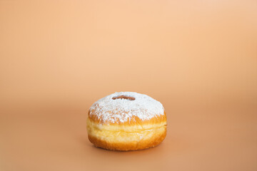Happy Hanukkah. Traditional Jewish dessert Sufganiyot. Celebrating Judaism holiday. Donuts with jam and sugar powder.