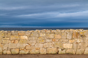 LOSSIEMOUTH, MORAY, SCOTLAND, UK - 18 NOVEMBER 2021 - This is a scene in November of wet beach area...