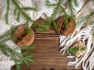 Obraz premium Christmas background. Handmade Christmas balls, a warm scarf, christmas tree. Zero waste