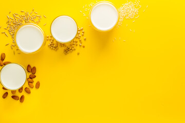 Dairy free vegan milk with nuts and cereals, top view