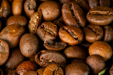 Roasted coffee beans closeup. All the details are visible.