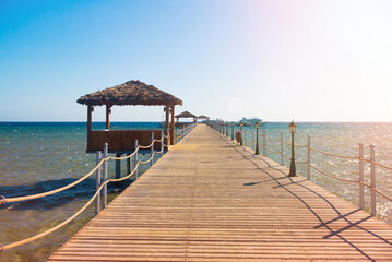 Pier, vacation. Thatched African gazebo, fale © Elina Leonova