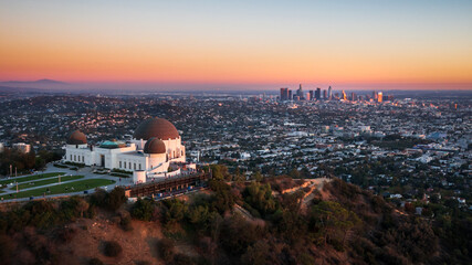 Aerial view of Griffith Observatory and Los Angeles city skyline at sunset