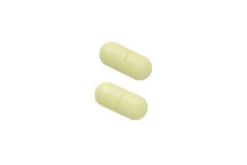 Light green oval pills isolated on white background.