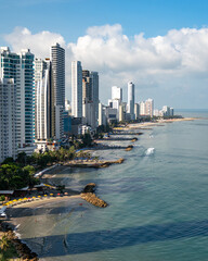 coast line of cartagena colombia with boats, beaches, and buildings - obrazy, fototapety, plakaty