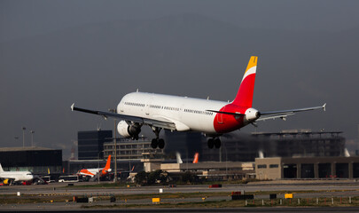 Airplane lands at the airport of Barcelona. Spain
