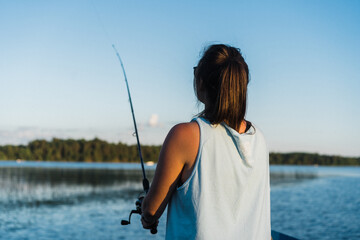 Young adult woman fishing