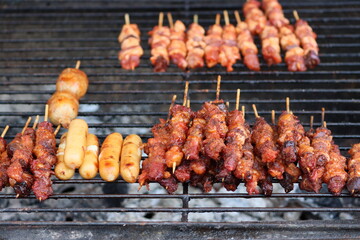 Cambodia. Khmers cook grilled beef and sausages. Siem Reap province.