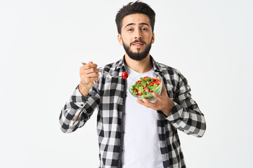 emotional bearded man in plaid shirt plate with salad