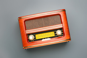 Retro radio receiver on grey background