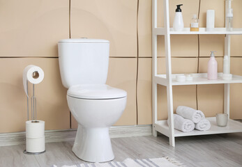 Interior of modern restroom with toilet bowl