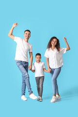 Obraz premium Happy interracial family on color background