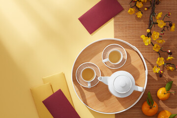 Chinese new year with mandarin orange , flower and red pocket , yellow background photography Tet holiday content , chinese new year