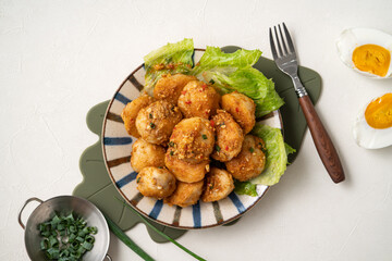 Deep fried cuttlefish ball with salted egg yolk coating