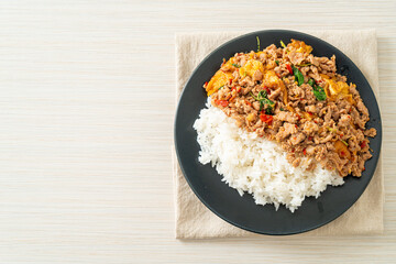 stir-fried minced pork with basil and egg topped on rice