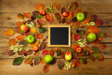 Black square chalkboard frame mockup with fall leaves